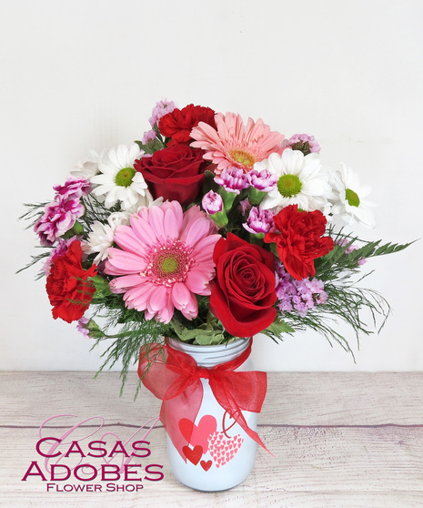Valentine's Day Mason Jar with red roses, pink gerbs, white daisies, purple statice 