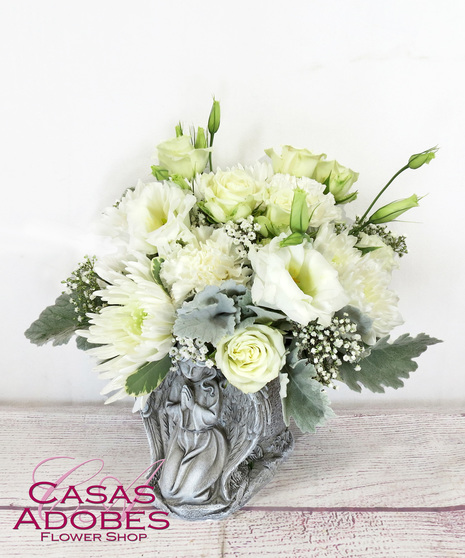 Keepsake Angel Container with all white flowers including roses, carnations, lisianthus and chrysanthemums
