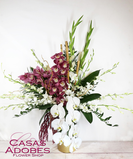 Gold trimmed vase with phalaenopsis orchids, dendrobium orchids,  and cymbidium orchids