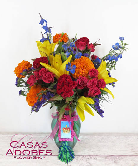 Vase with marigolds, delphinium, lily, coxcomb, and pink spray roses