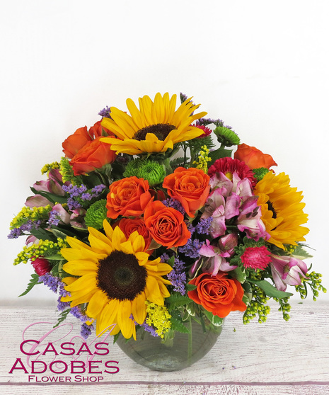 vase with sunflowers, hot pink asters, lime green button mums, purple alstroemeria