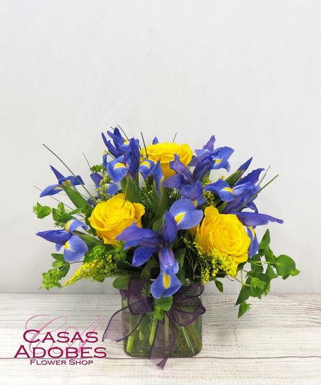 Cube vase with iris accent with solid aster and bupleurum